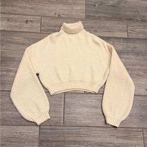 Beige ribbed knit sweater with a turtleneck